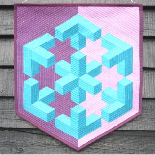 Poles Apart quilt pattern by Little Patch Pockets featuring a striking 3D geometric design in turquoise, pink and purple fabrics